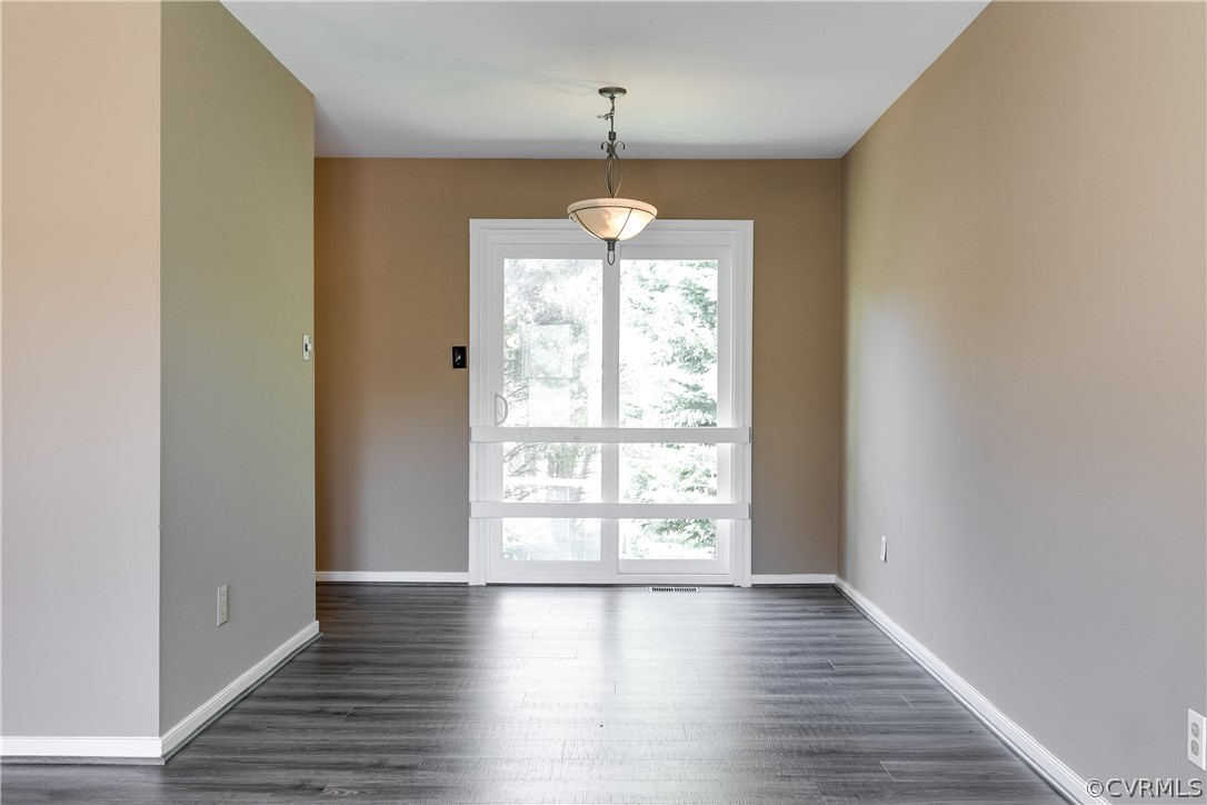 5212 South Jessup Road Chesterfield, VA 23832 - Photo 5 of 25 an empty room with wooden floor and windows