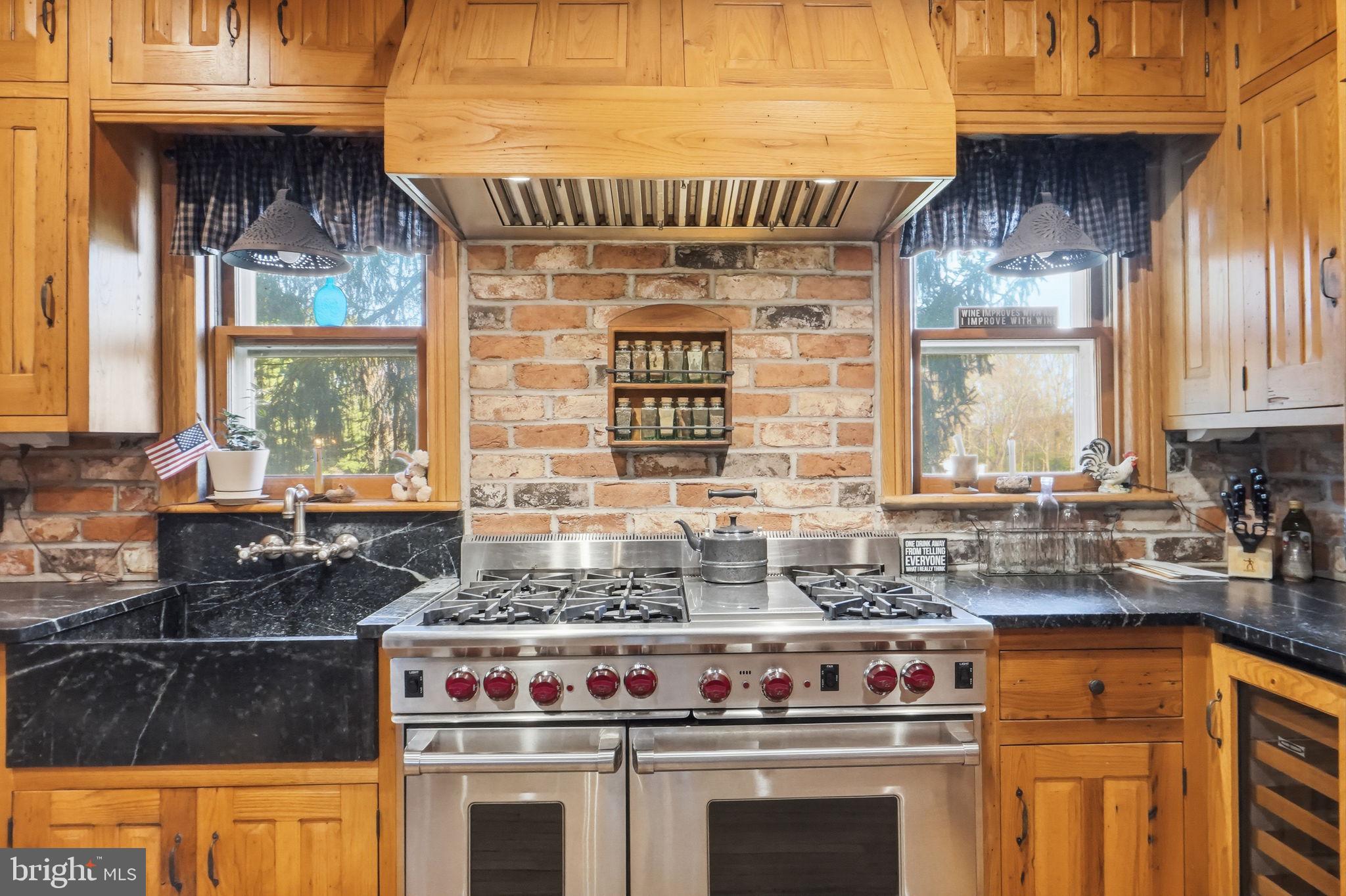 13405 John Kline Road Smithsburg, MD 21783 - Photo 16 of 96 a kitchen with stainless steel appliances granite countertop a stove a sink and a microwave