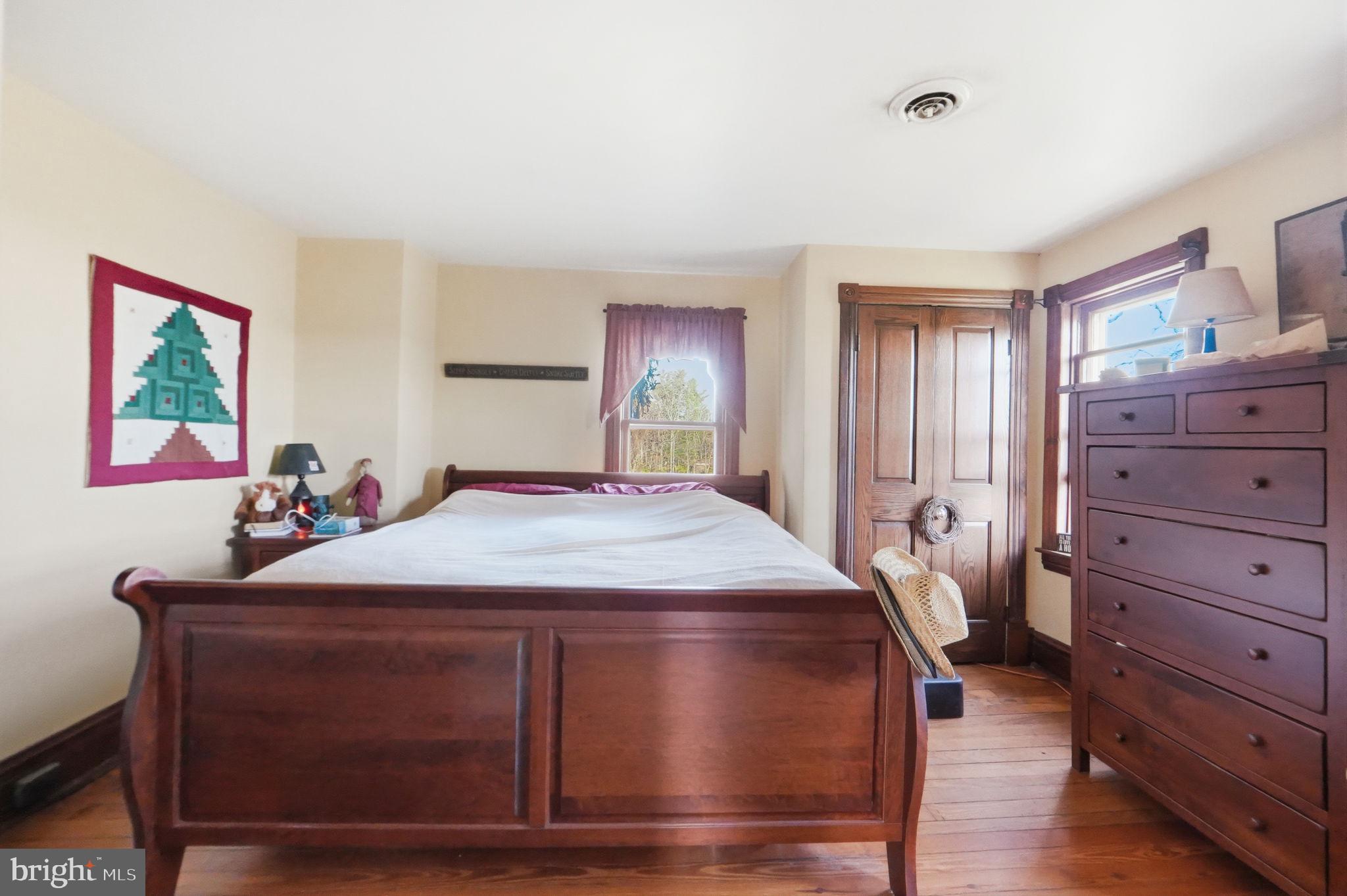 13405 John Kline Road Smithsburg, MD 21783 - Photo 20 of 96 a bedroom with a bed and a dresser