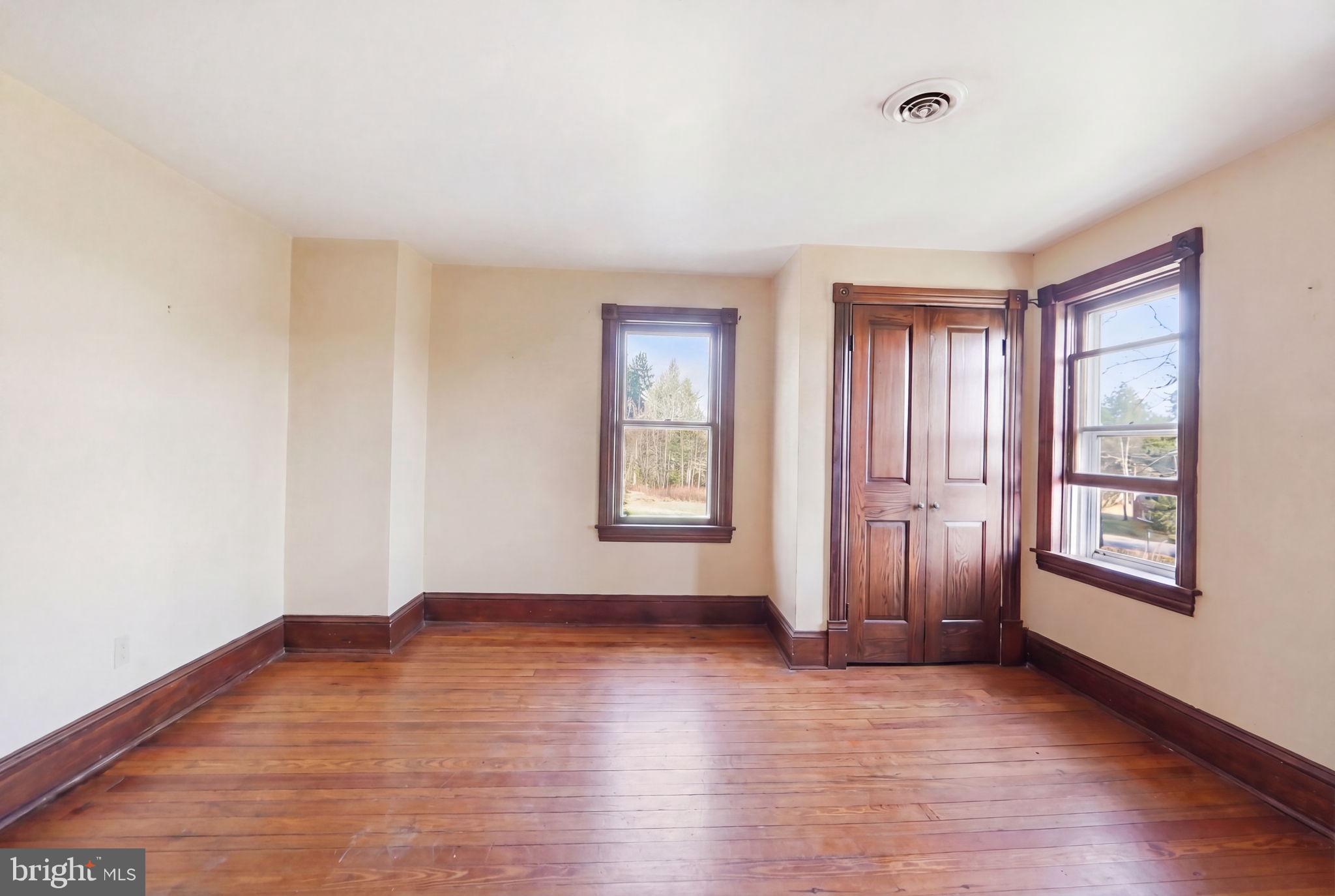 13405 John Kline Road Smithsburg, MD 21783 - Photo 21 of 96 an empty room with wooden floor and windows