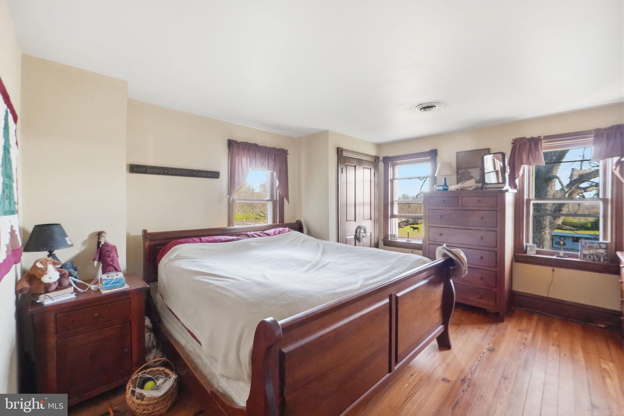 13405 John Kline Road Smithsburg, MD 21783 - Photo 22 of 96 a bed room with a bed and a dresser