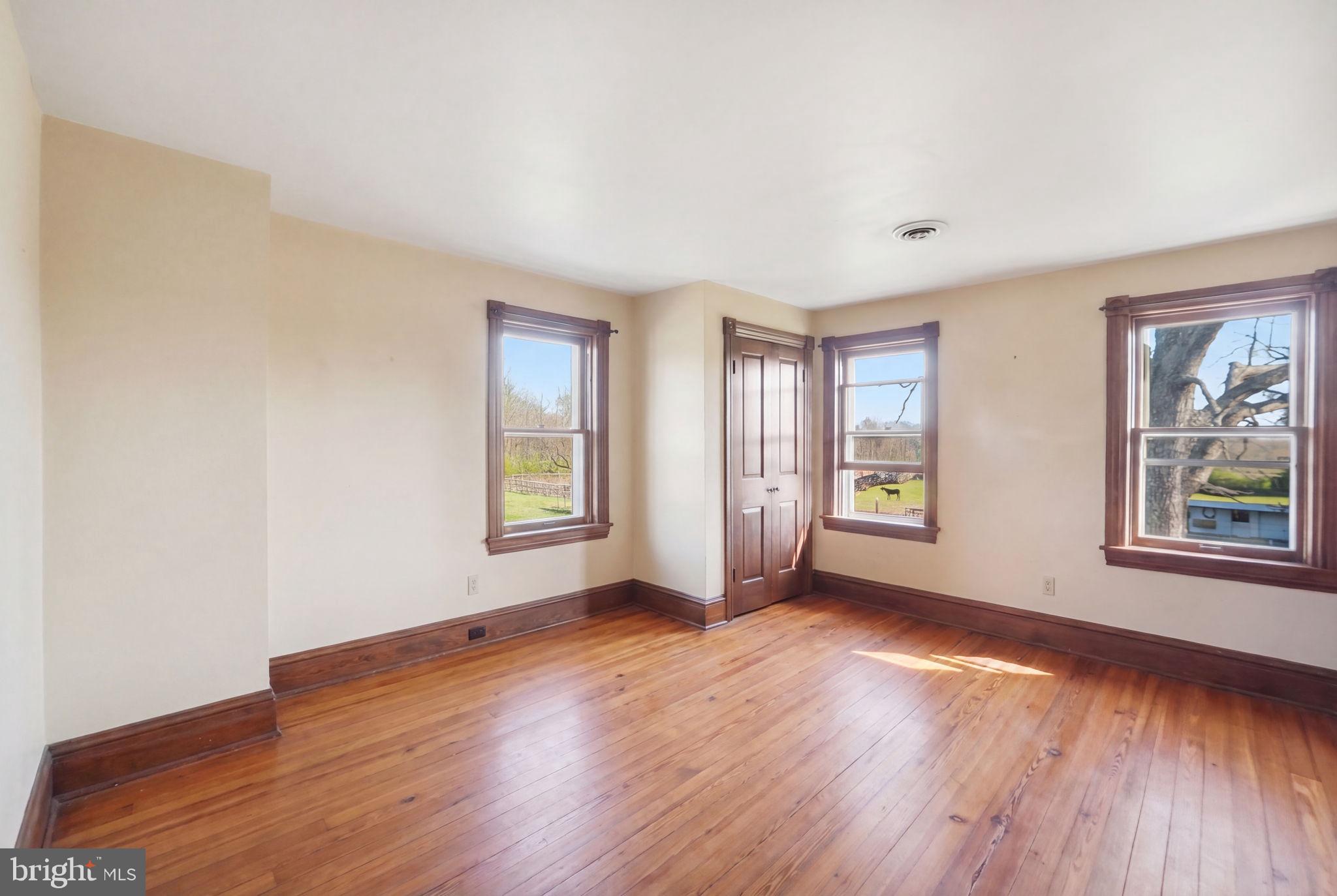 13405 John Kline Road Smithsburg, MD 21783 - Photo 23 of 96 an empty room with wooden floor and windows