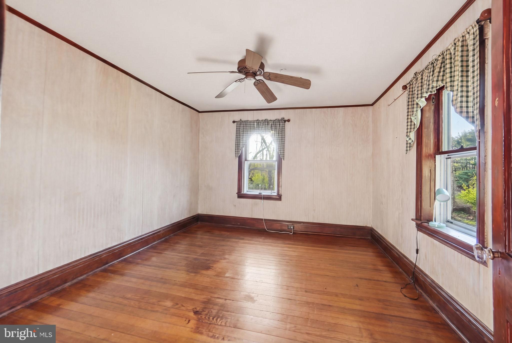 13405 John Kline Road Smithsburg, MD 21783 - Photo 30 of 96 a view of an empty room with wooden floor and a window