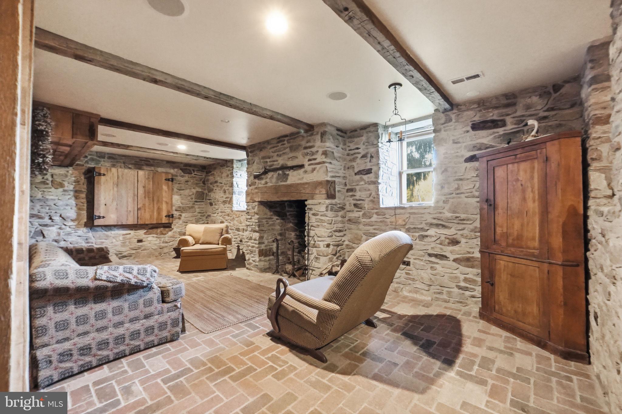 13405 John Kline Road Smithsburg, MD 21783 - Photo 36 of 96 a living room with furniture and a fireplace