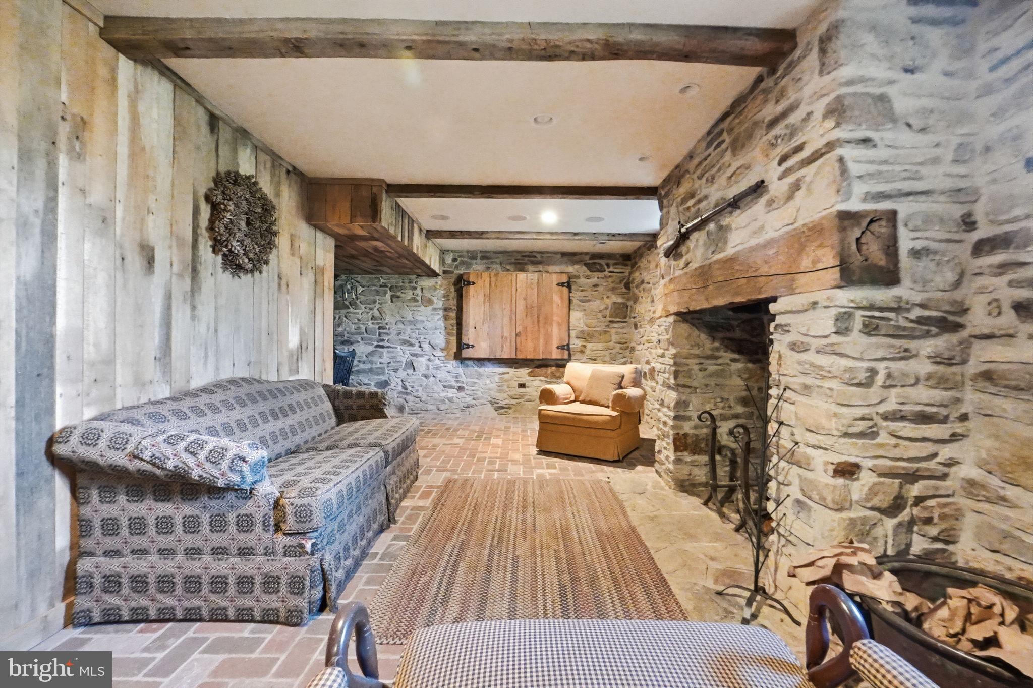 13405 John Kline Road Smithsburg, MD 21783 - Photo 37 of 96 a living room with furniture and a fireplace