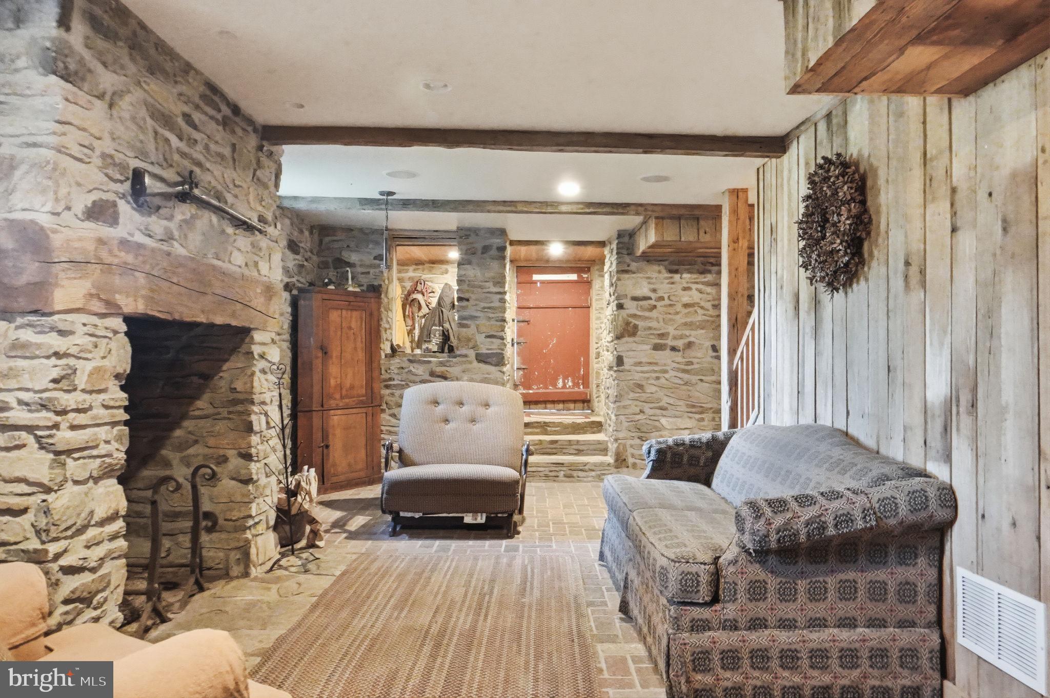 13405 John Kline Road Smithsburg, MD 21783 - Photo 39 of 96 a living room with furniture and a fireplace