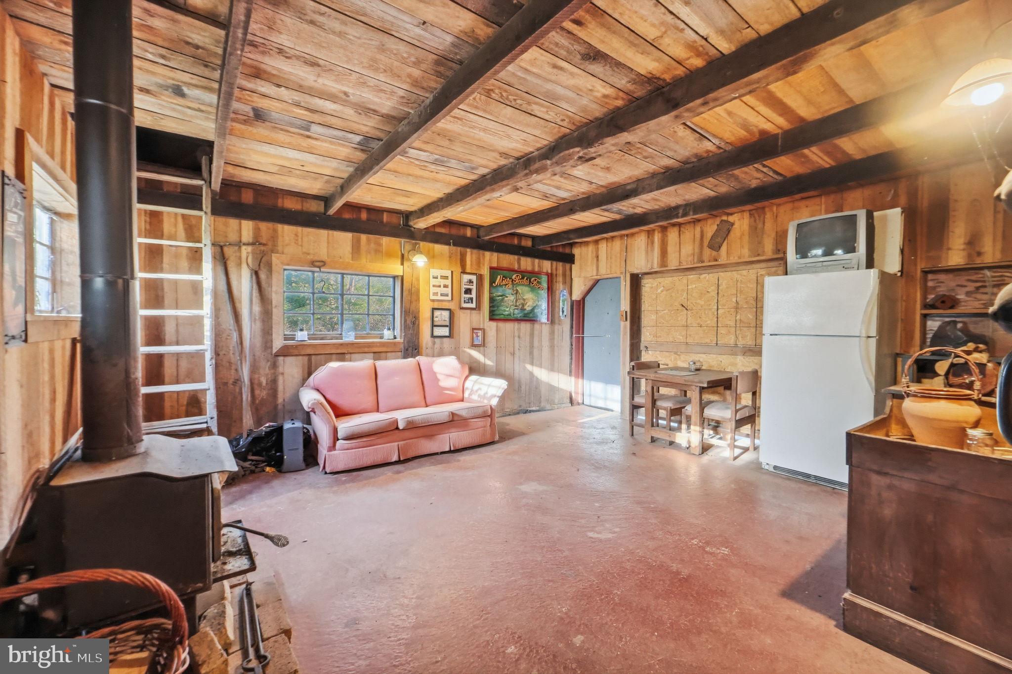 13405 John Kline Road Smithsburg, MD 21783 - Photo 55 of 96 a living room with furniture a couch and to ceiling window