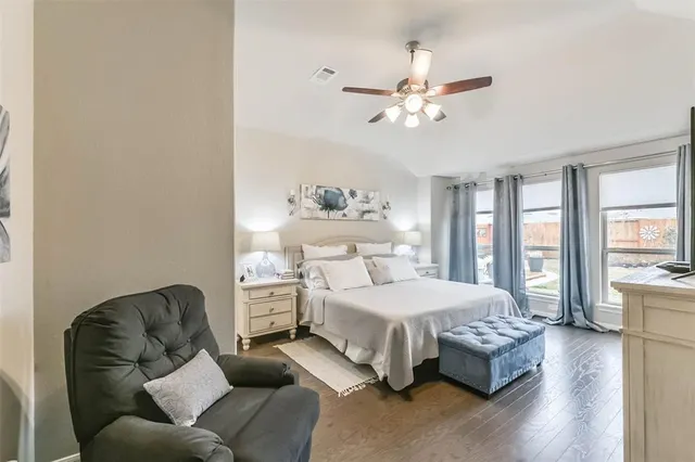 a bedroom with a bed couch and window