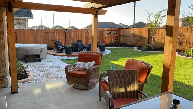 a view of a patio with couches chairs potted plants and a table