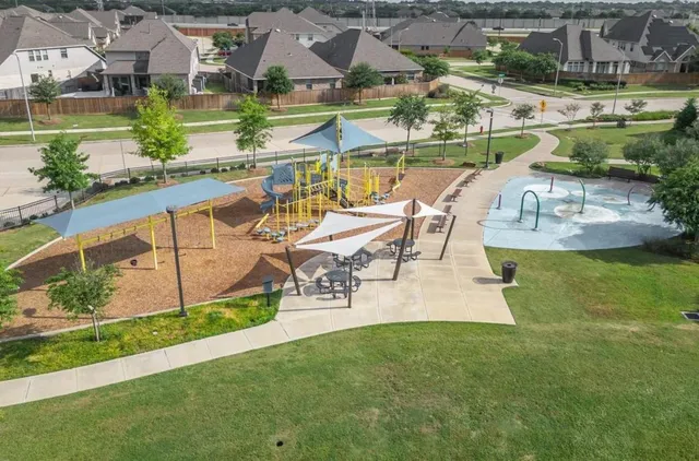 an aerial view of a house with swimming pool patio and outdoor seating