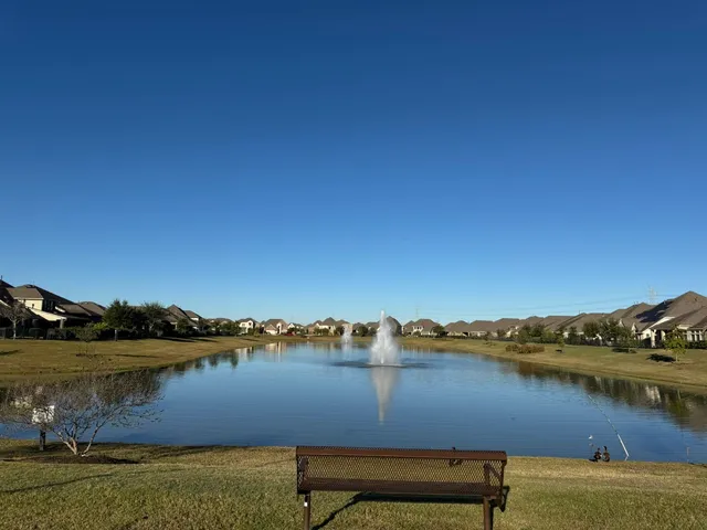 a view of a lake with houses in the background