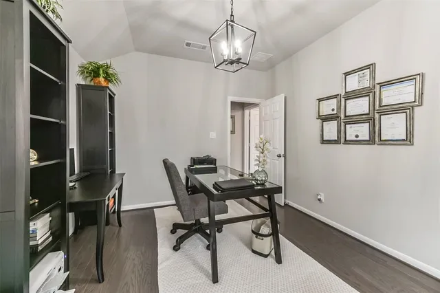 a view of a livingroom with furniture and a window