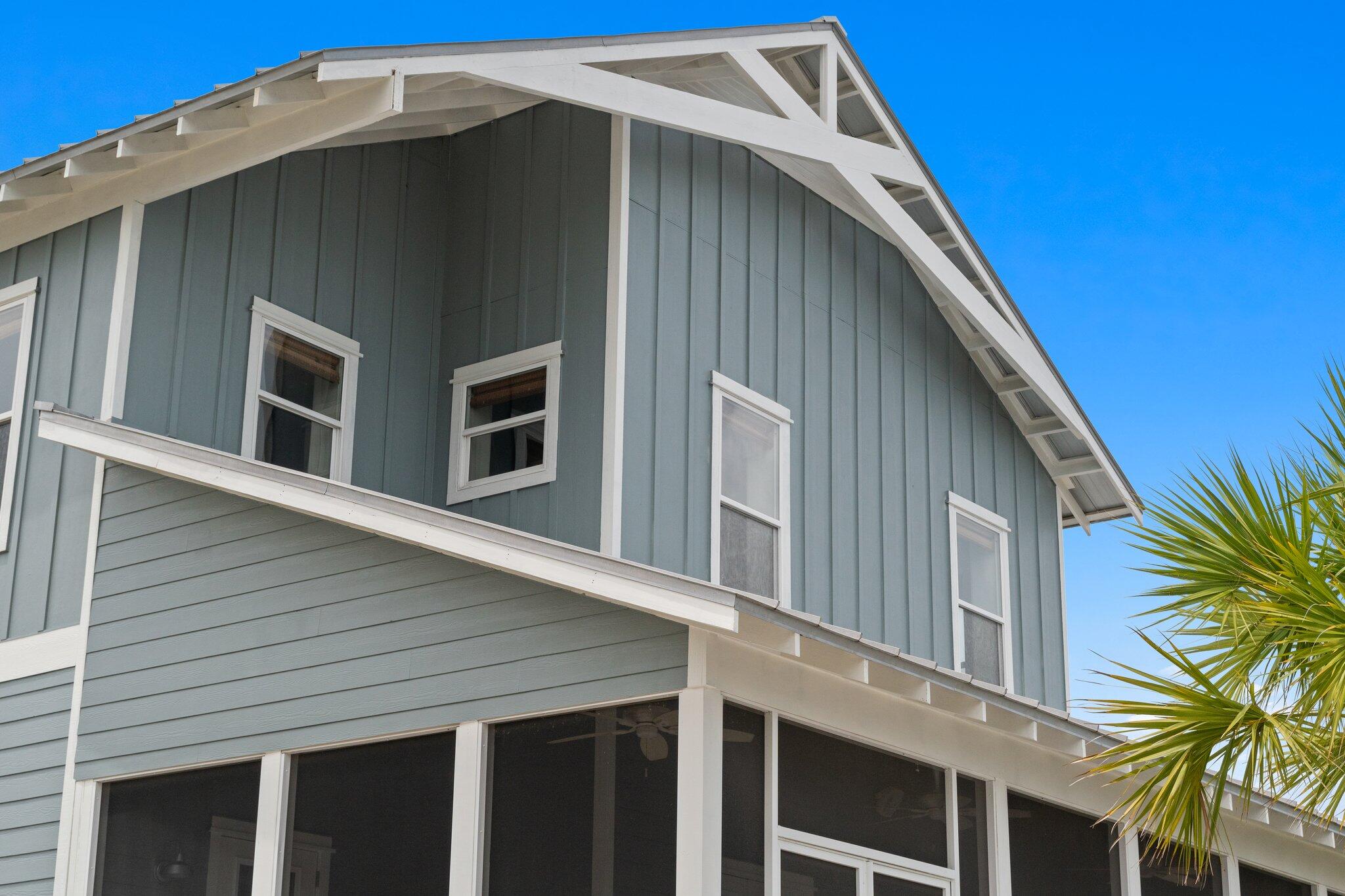 104 Pinwheel Court Port St. Joe, FL 32456 - Photo 101 of 119 a front view of a house with a yard