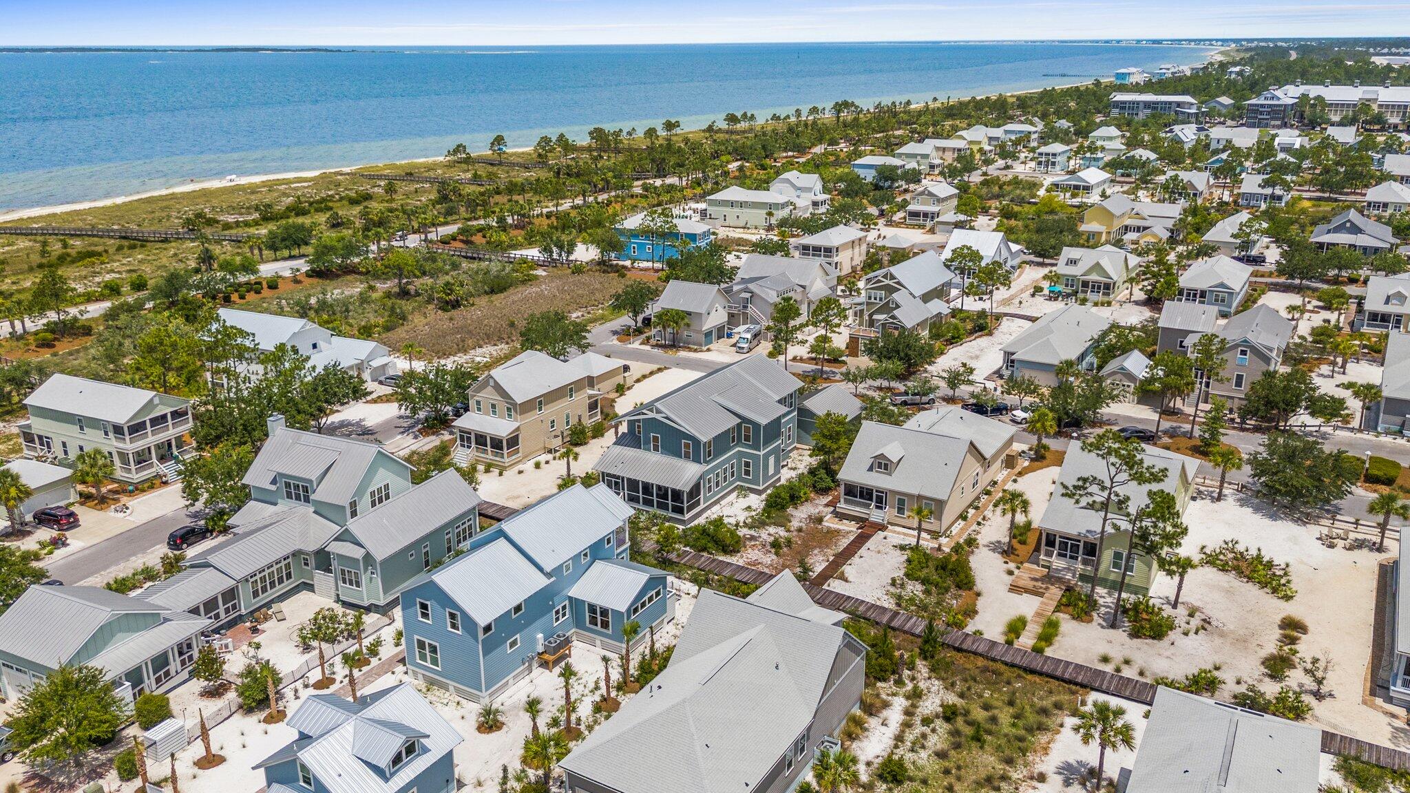 104 Pinwheel Court Port St. Joe, FL 32456 - Photo 106 of 119 an aerial view of residential building with parking