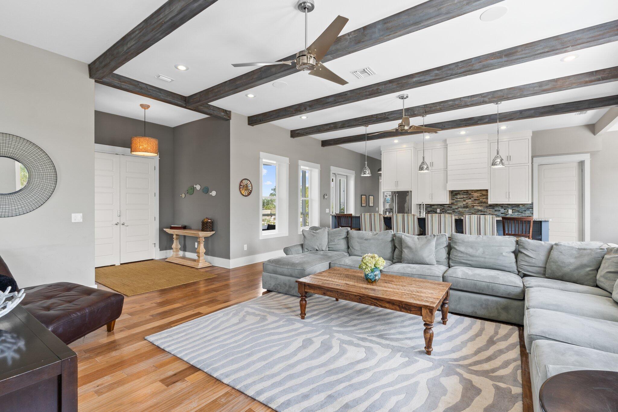 104 Pinwheel Court Port St. Joe, FL 32456 - Photo 13 of 119 a living room with furniture and a wooden floor