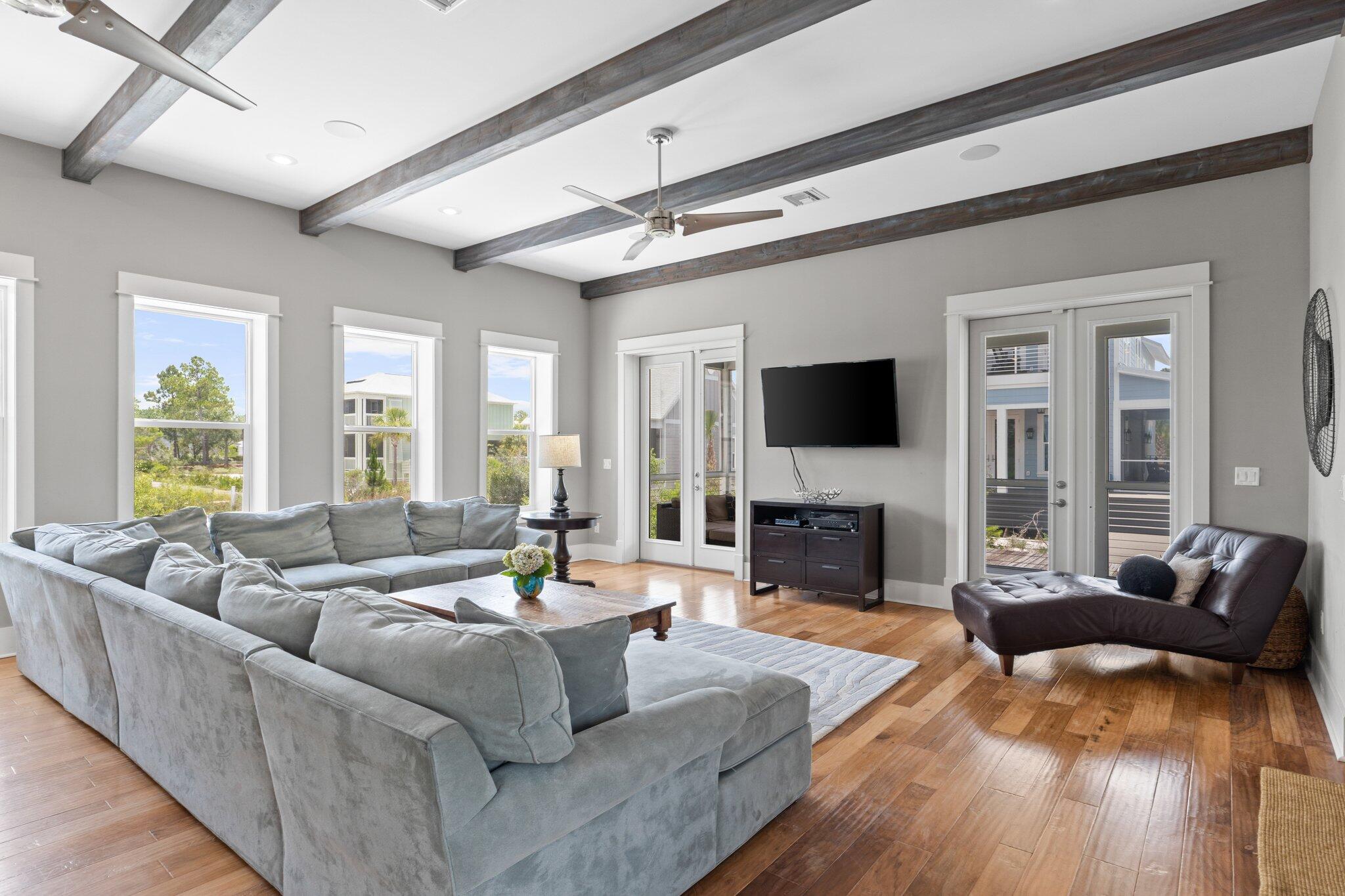 104 Pinwheel Court Port St. Joe, FL 32456 - Photo 15 of 119 a living room with fireplace furniture and a flat screen tv