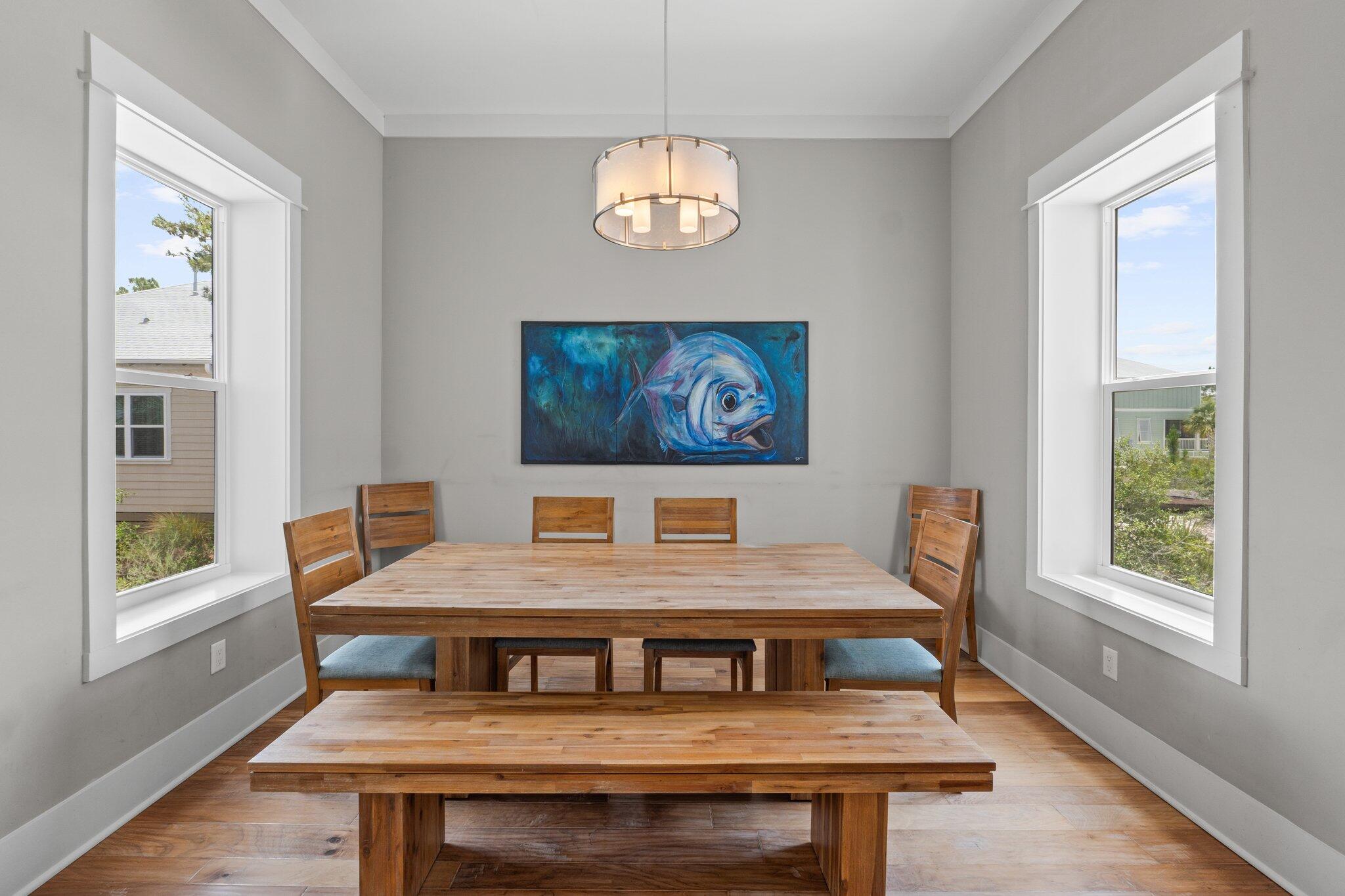 104 Pinwheel Court Port St. Joe, FL 32456 - Photo 32 of 119 a living room with a table chairs and a window