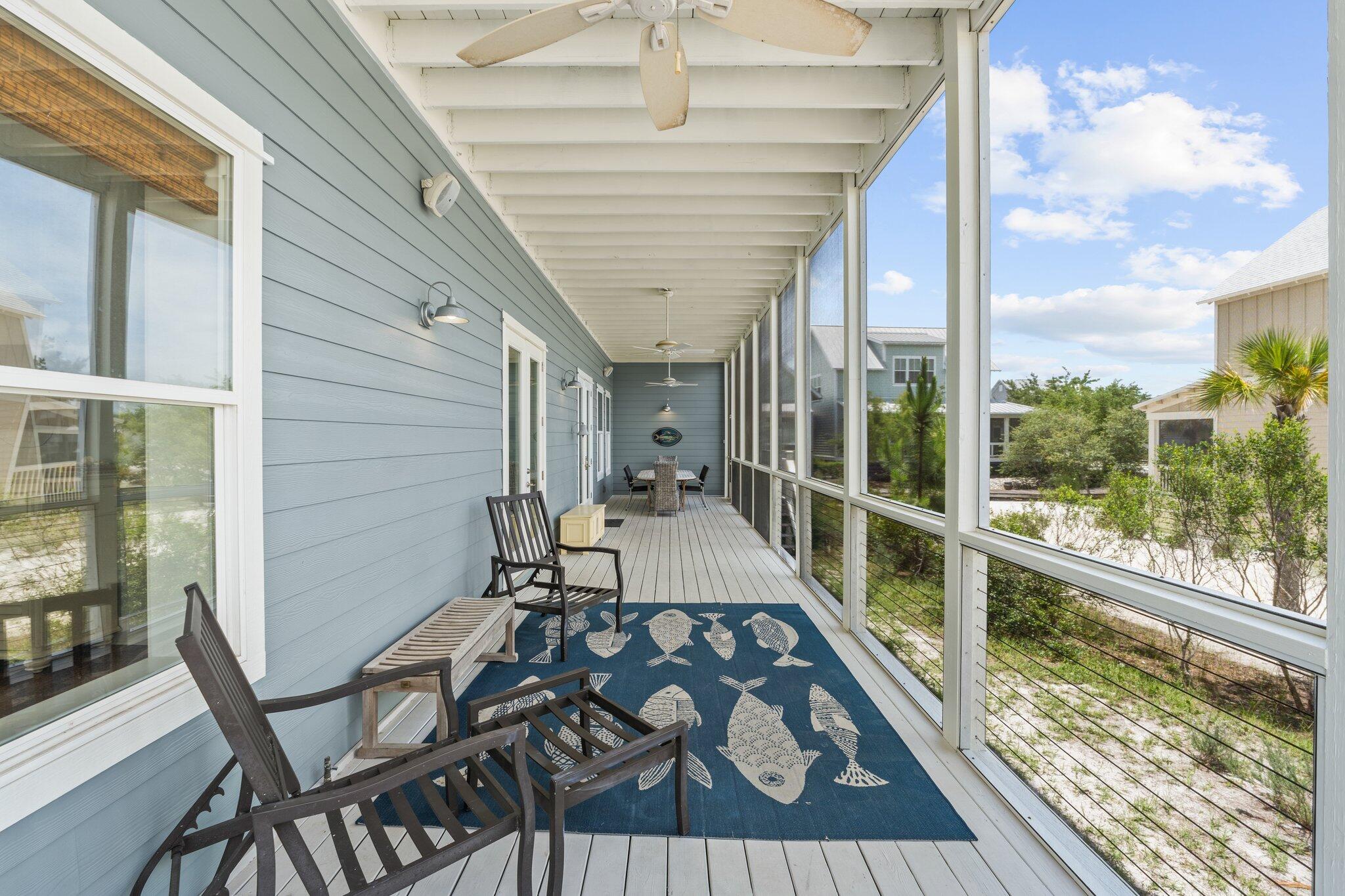 104 Pinwheel Court Port St. Joe, FL 32456 - Photo 34 of 119 a view of a balcony with chair and wooden floor