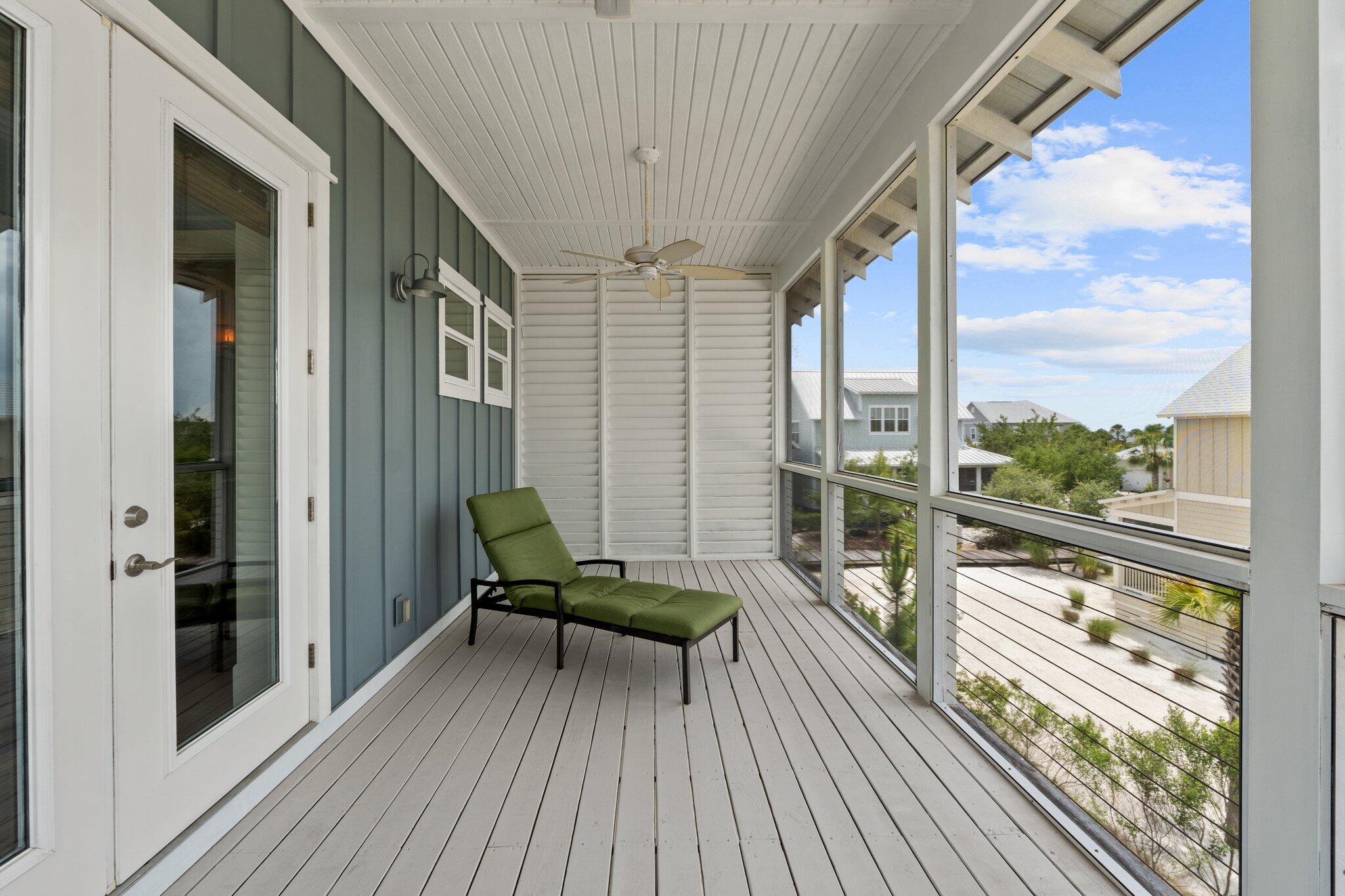 104 Pinwheel Court Port St. Joe, FL 32456 - Photo 53 of 119 a view of a balcony with chairs and wooden floor