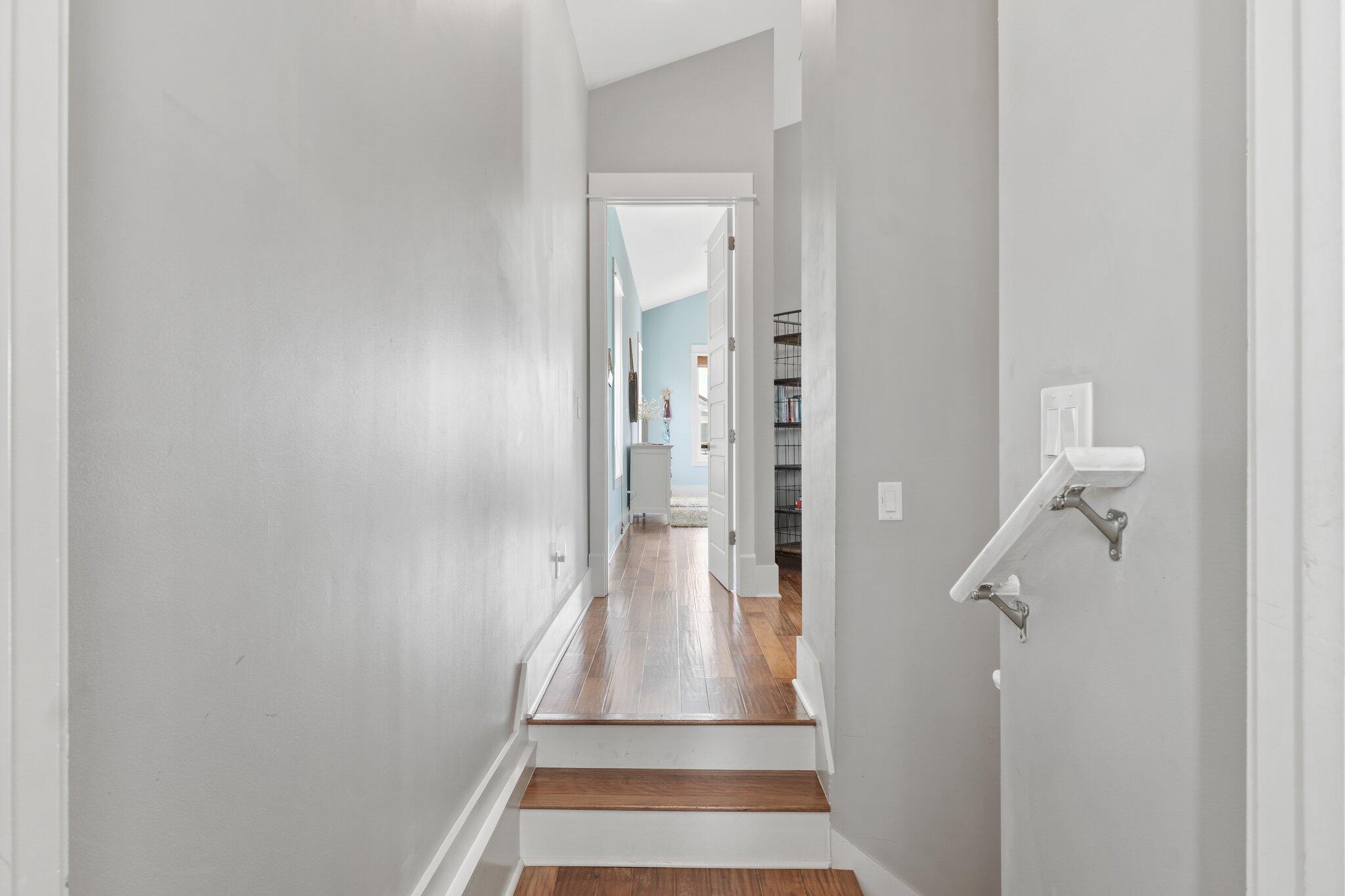 104 Pinwheel Court Port St. Joe, FL 32456 - Photo 66 of 119 a view of a hallway with white walls and a white door