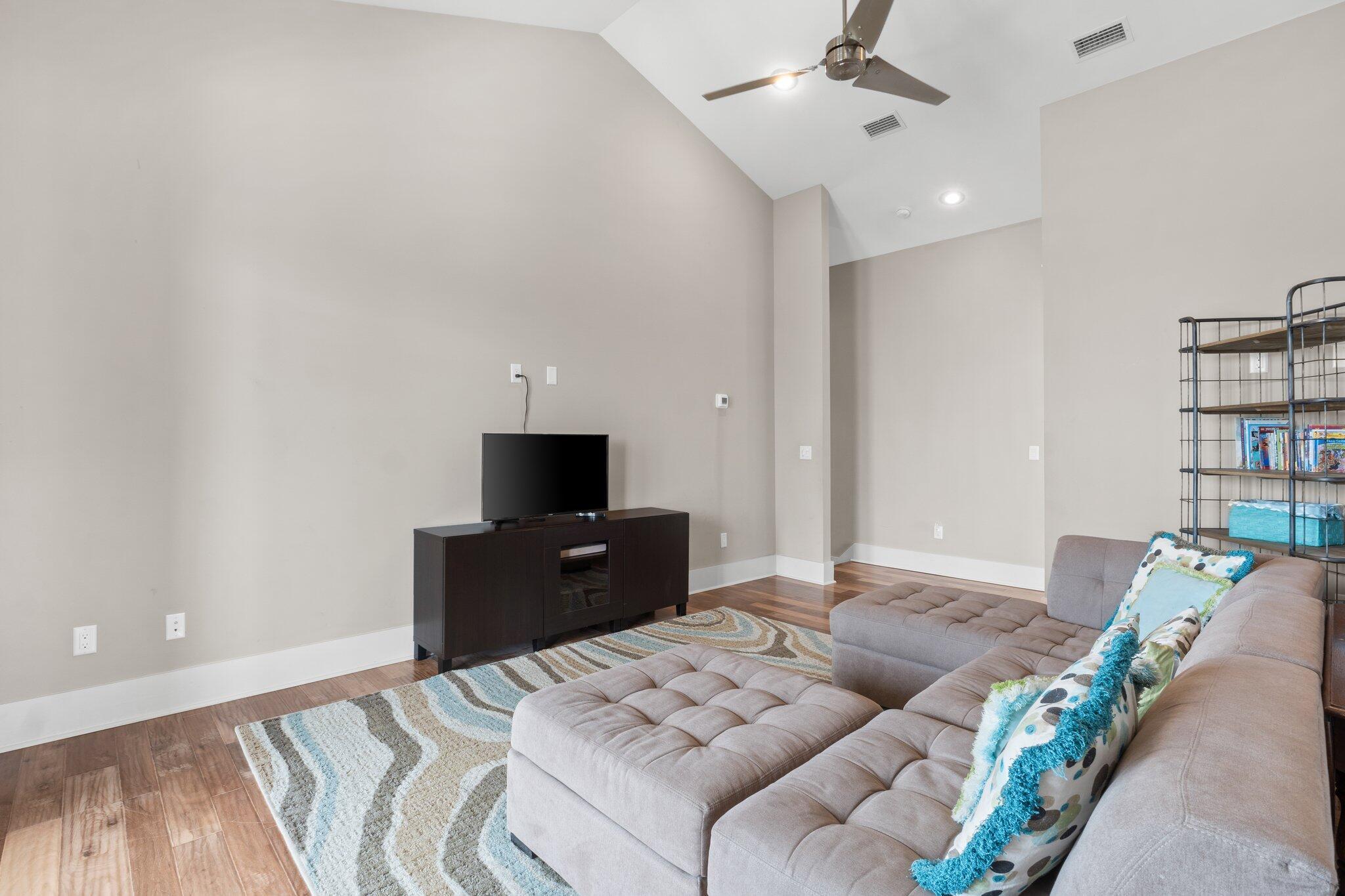 104 Pinwheel Court Port St. Joe, FL 32456 - Photo 72 of 119 a bedroom with a bed and a television