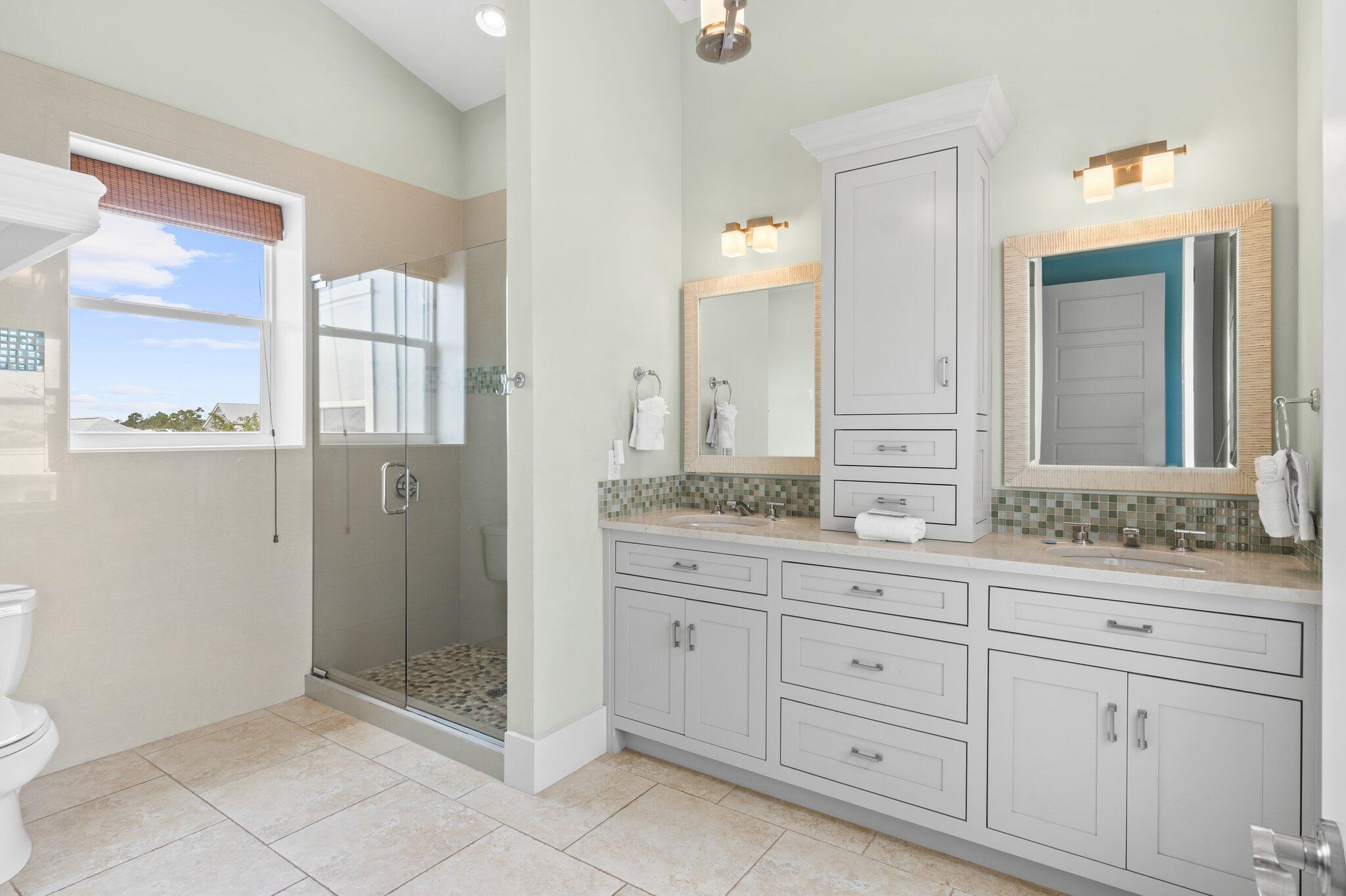 104 Pinwheel Court Port St. Joe, FL 32456 - Photo 85 of 119 a spacious bathroom with double sink and a mirror