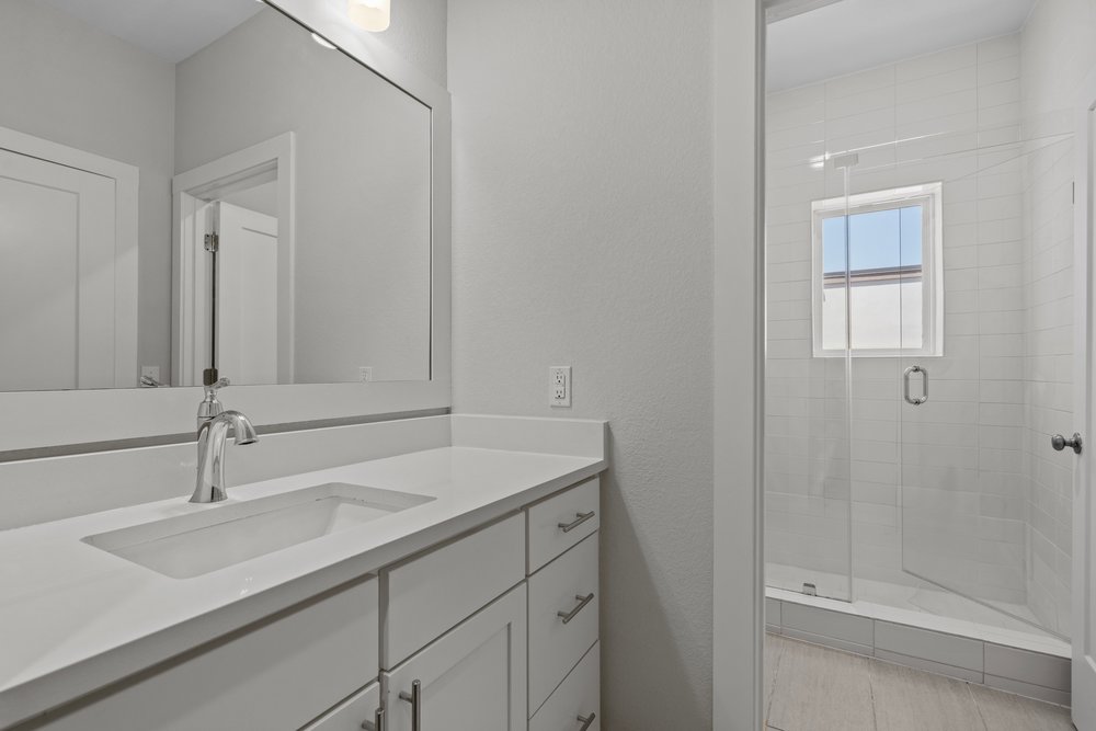 2827 Manor Road, Unit 2201 Austin, TX 78722 - Photo 36 of 40 Bathroom featuring a vanity with an integrated sink, polished chrome faucet, and white countertop