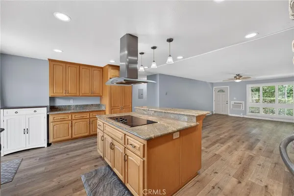 a kitchen that has a lot of cabinets in it