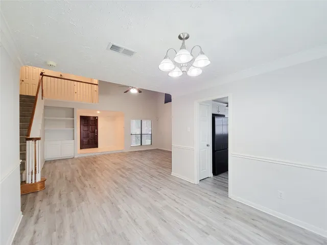 a kitchen with a stove a sink and a microwave