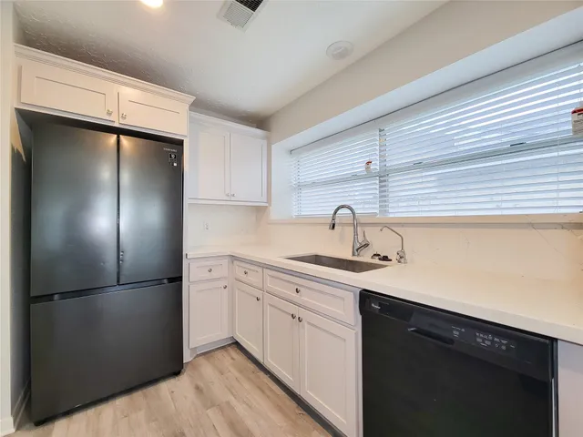 a view of an empty room and wooden floor