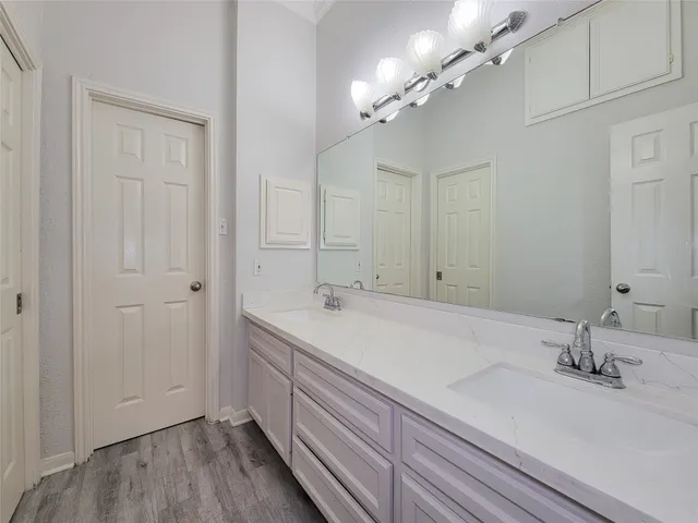 a white toilet sitting next to a shower
