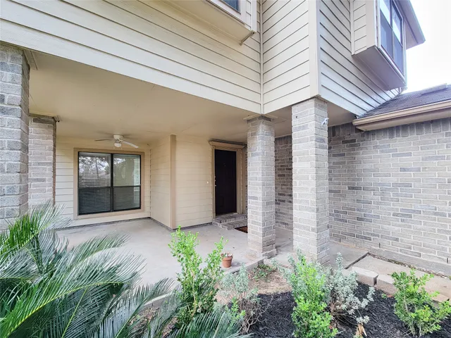 a view of a white house with windows