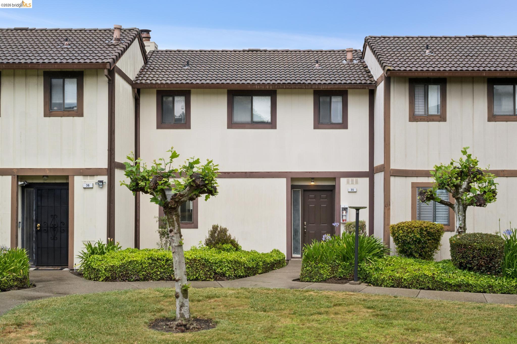 a front view of a house with garden