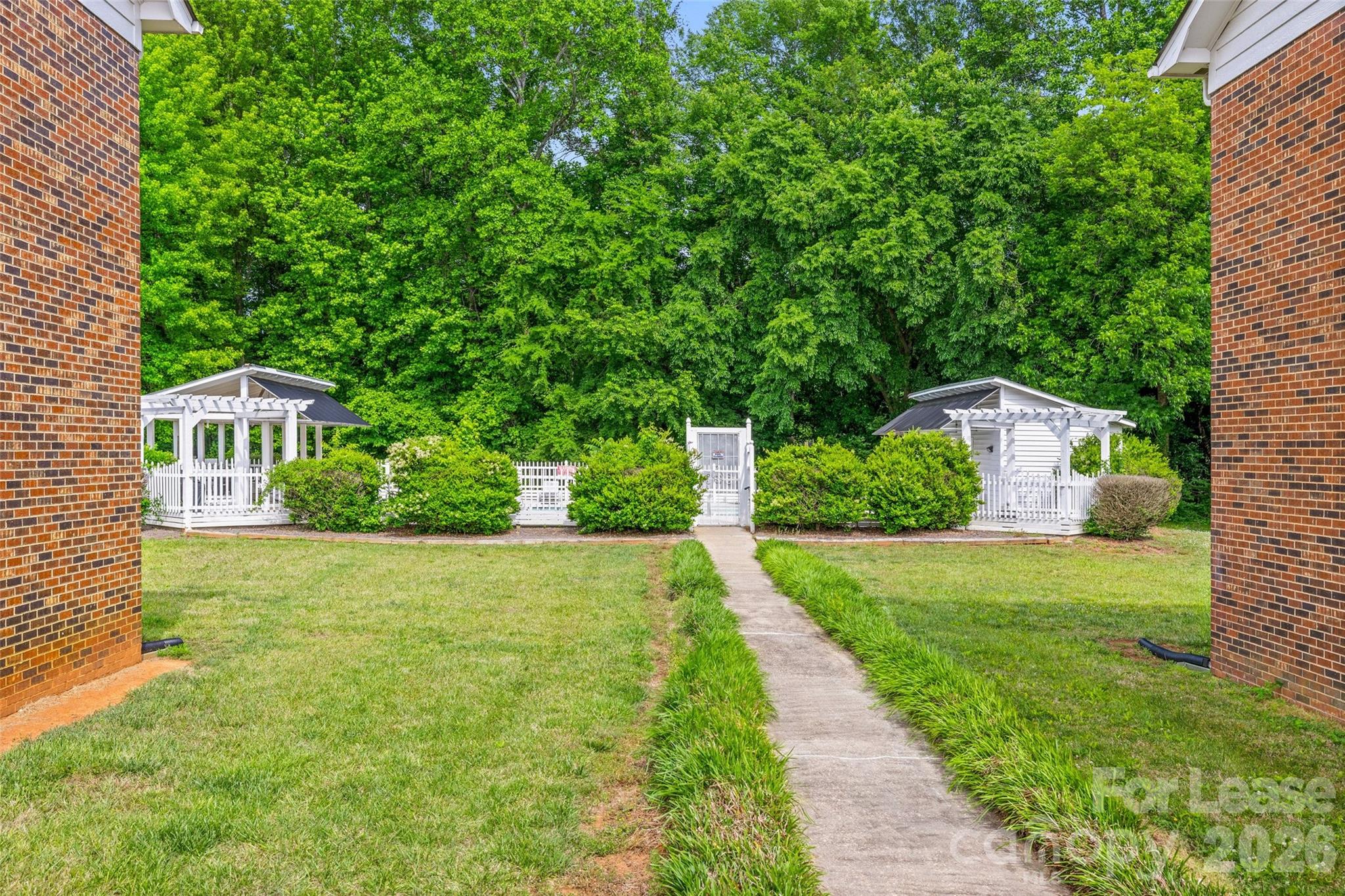 113 Stroupe Road, Unit E Gastonia, NC 28056 - Photo 27 of 33 a front view of a house with garden