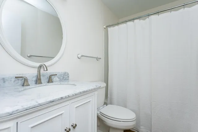 a view of an empty room with a cabinet