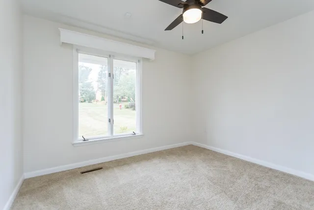 an aerial view of a house with a garden