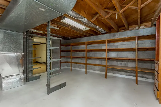 an aerial view of residential houses with outdoor space and river