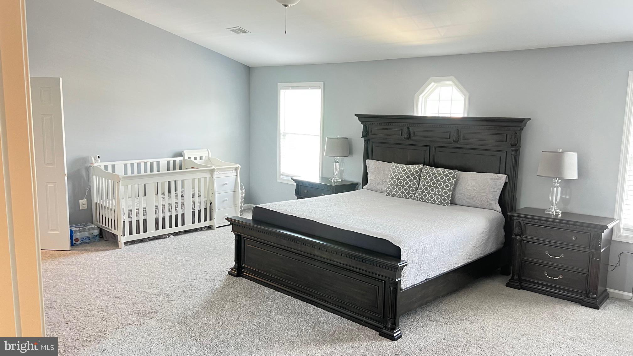 811 223rd Street Pasadena, MD 21122 - Photo 14 of 31 a bedroom with a bed and a window