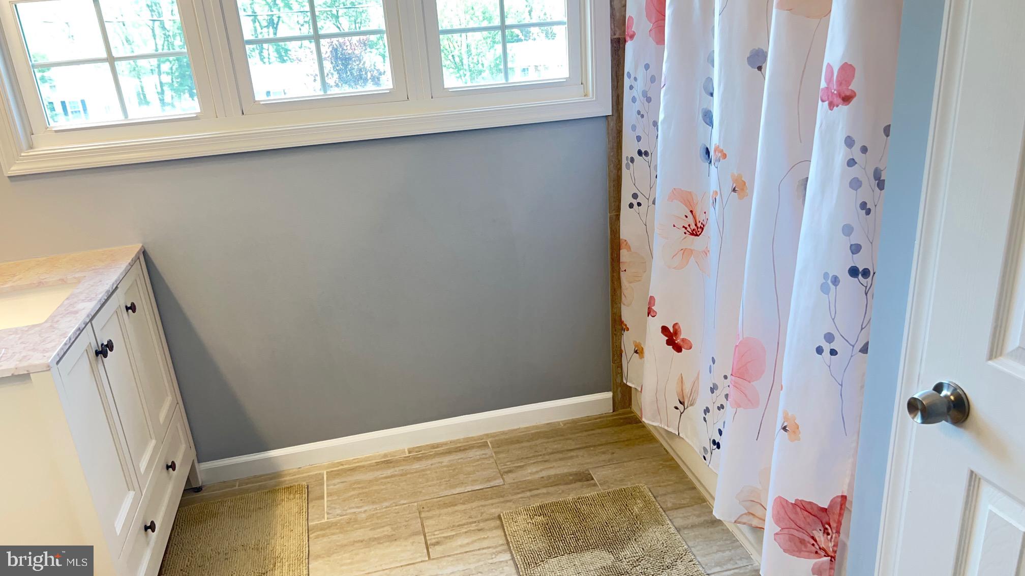 811 223rd Street Pasadena, MD 21122 - Photo 23 of 31 a view of an entryway with wooden floor