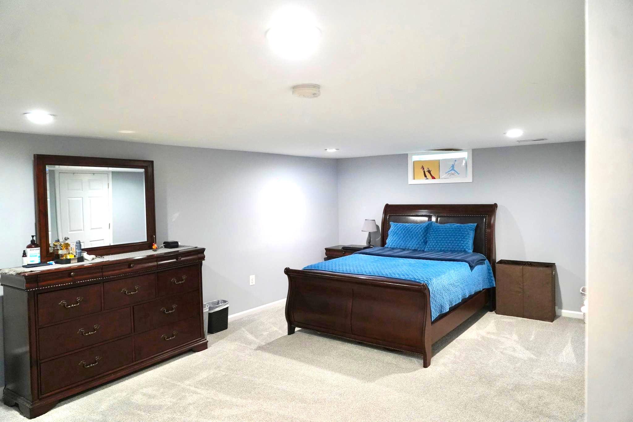 811 223rd Street Pasadena, MD 21122 - Photo 25 of 31 a bedroom with a bed and a dresser