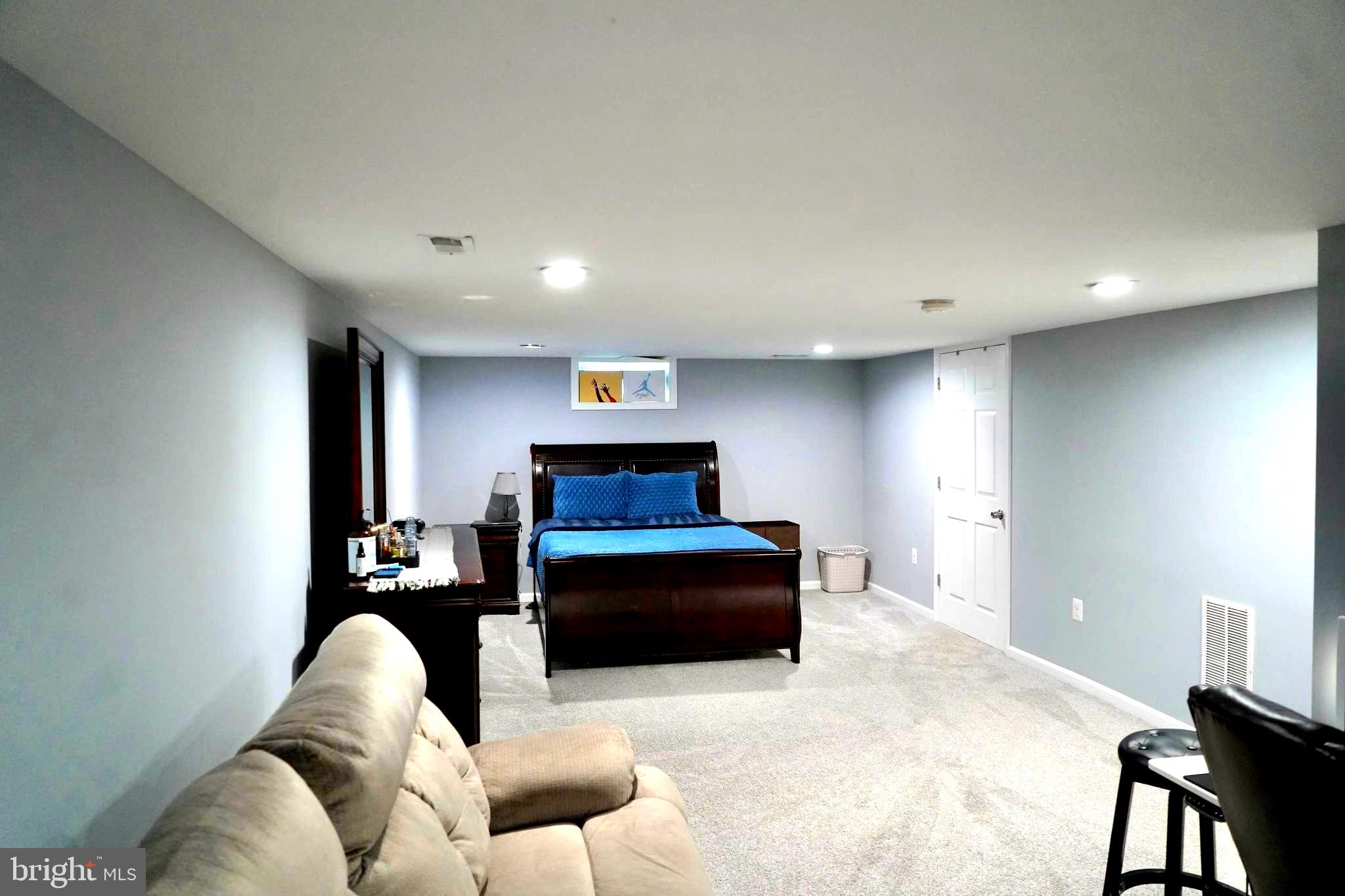 811 223rd Street Pasadena, MD 21122 - Photo 26 of 31 a living room with furniture and a couch