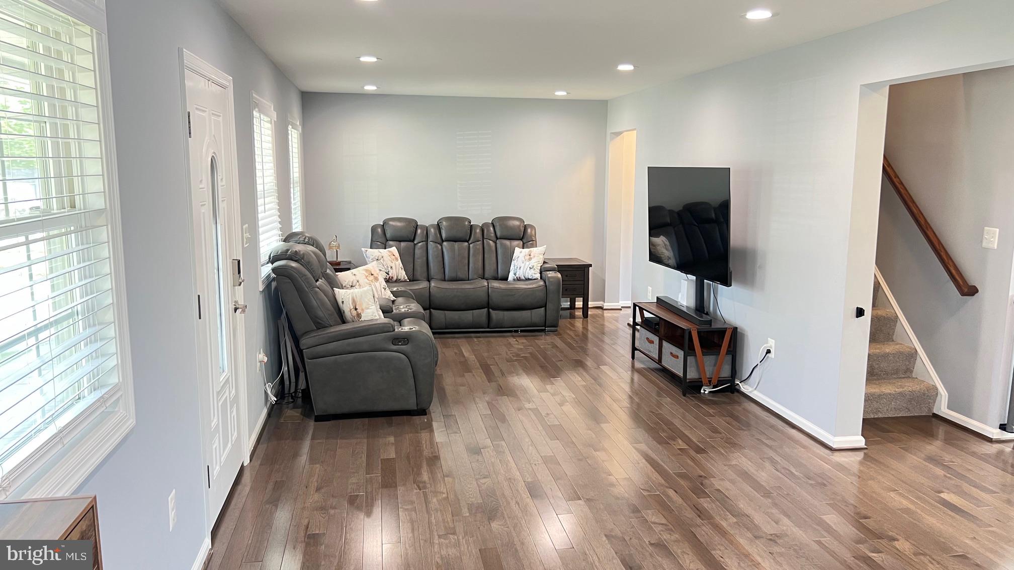 811 223rd Street Pasadena, MD 21122 - Photo 6 of 31 a living room with furniture and a flat screen tv