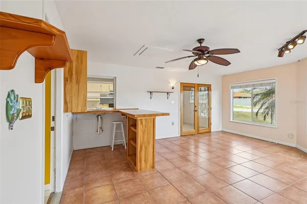 a view of a kitchen with a sink and a window