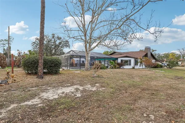 a view of a house with a yard and garage