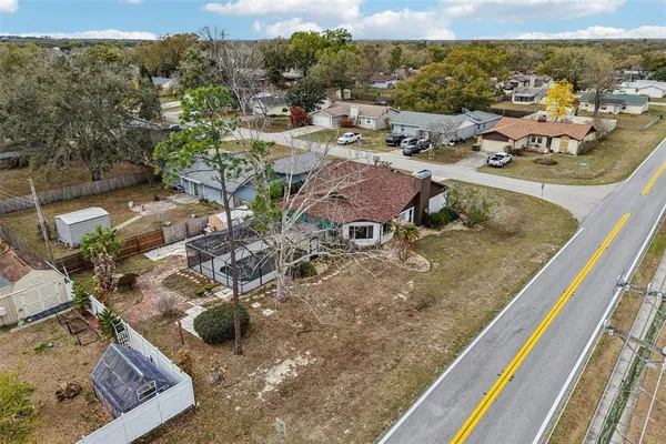 an aerial view of residential houses with outdoor space