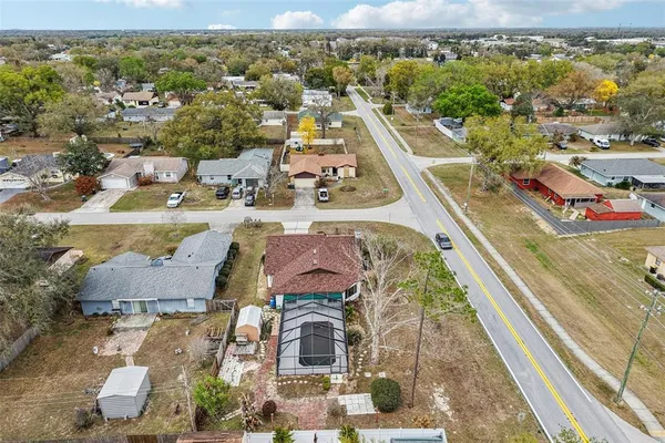an aerial view of residential houses with outdoor space