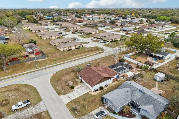 an aerial view of a house with a swimming pool