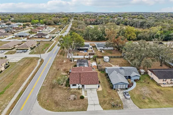 an aerial view of residential houses with outdoor space