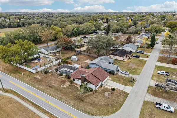 an aerial view of a residential houses with city view