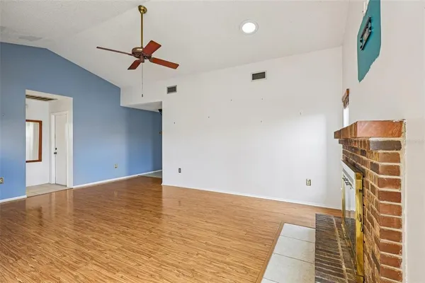 a view of an empty room with a chandelier